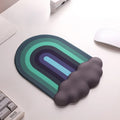 A rainbow-themed ergonomic wrist rest set, including a cloud-cushioned mouse pad and a matching keyboard wrist support, designed with a gradient rainbow pattern and soft white cloud accents