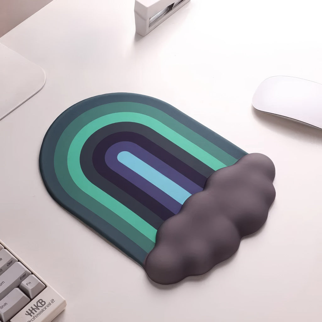 A rainbow-themed ergonomic wrist rest set, including a cloud-cushioned mouse pad and a matching keyboard wrist support, designed with a gradient rainbow pattern and soft white cloud accents