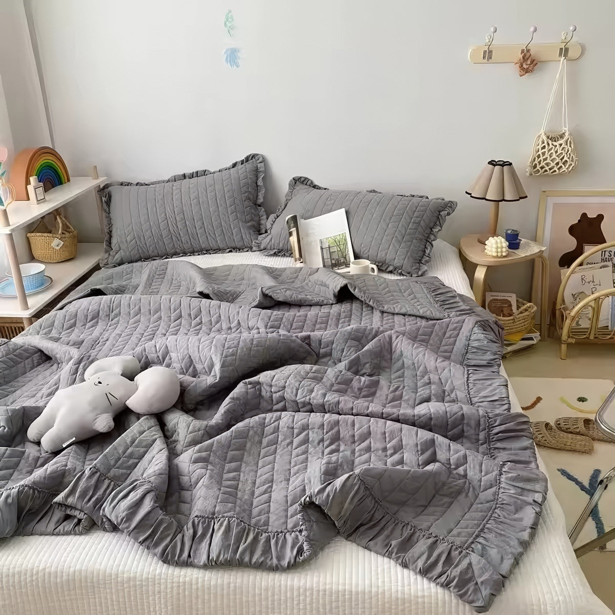 Ruffled summer quilt set with chevron stitching and ruffle trim, available in pastel and neutral colors