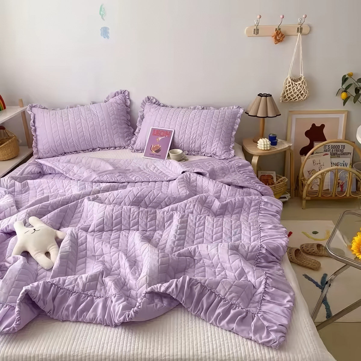 Ruffled summer quilt set with chevron stitching and ruffle trim, available in pastel and neutral colors