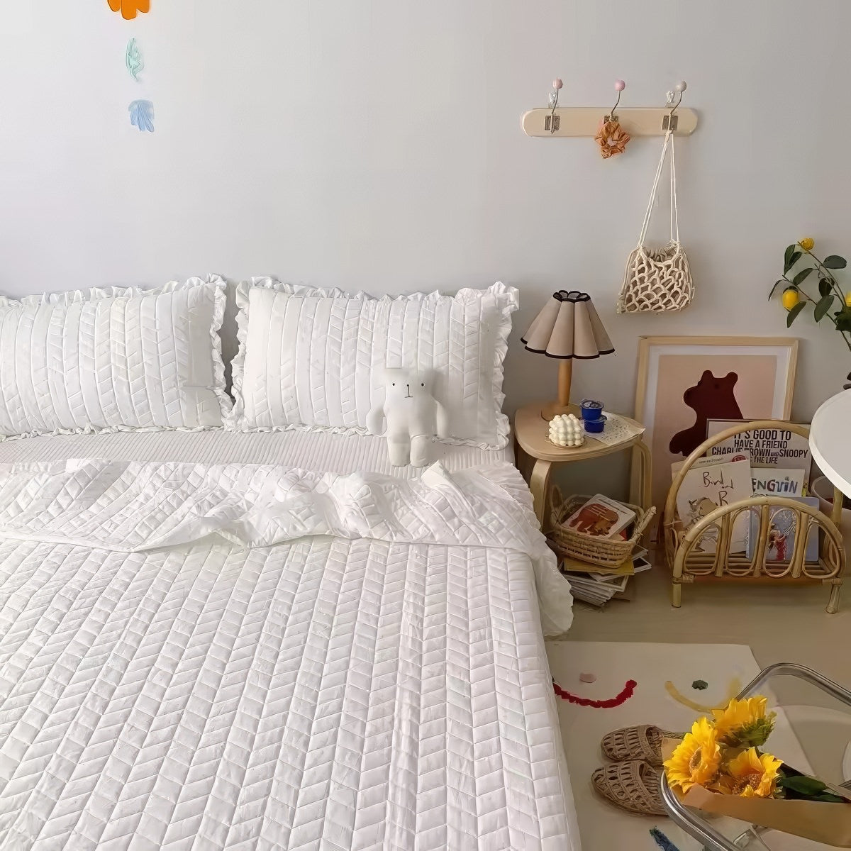 Ruffled summer quilt set with chevron stitching and ruffle trim, available in pastel and neutral colors