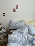 Light blue striped cotton duvet cover set with matching pillowcases