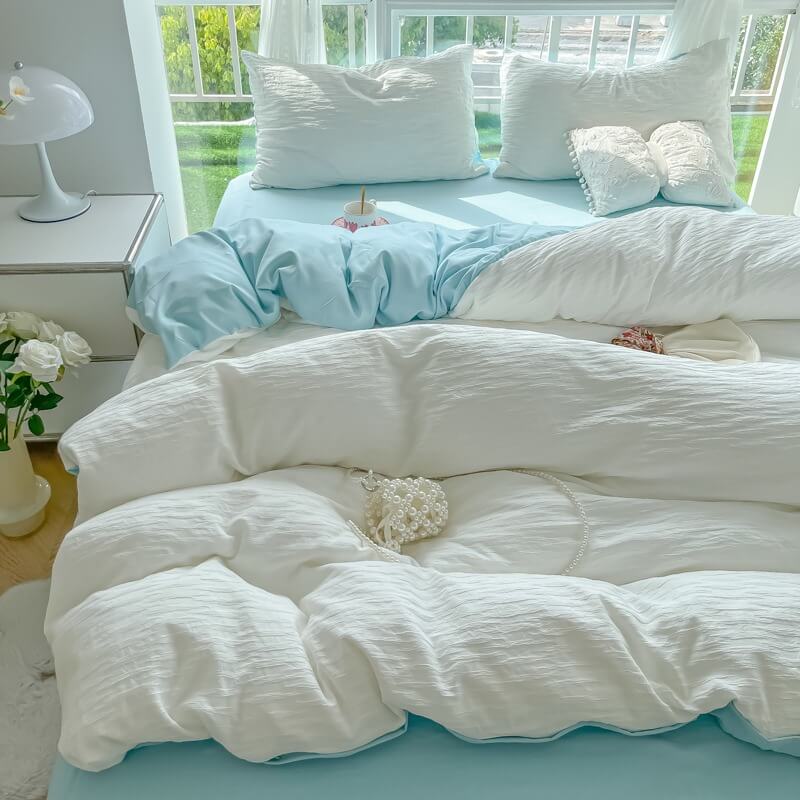 soft cloud ribbed washed cotton effect bedding set in light blue and white colors