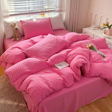 bright pink color bedding set with waffled duvet cover and shams and matching flat sheet roomtery