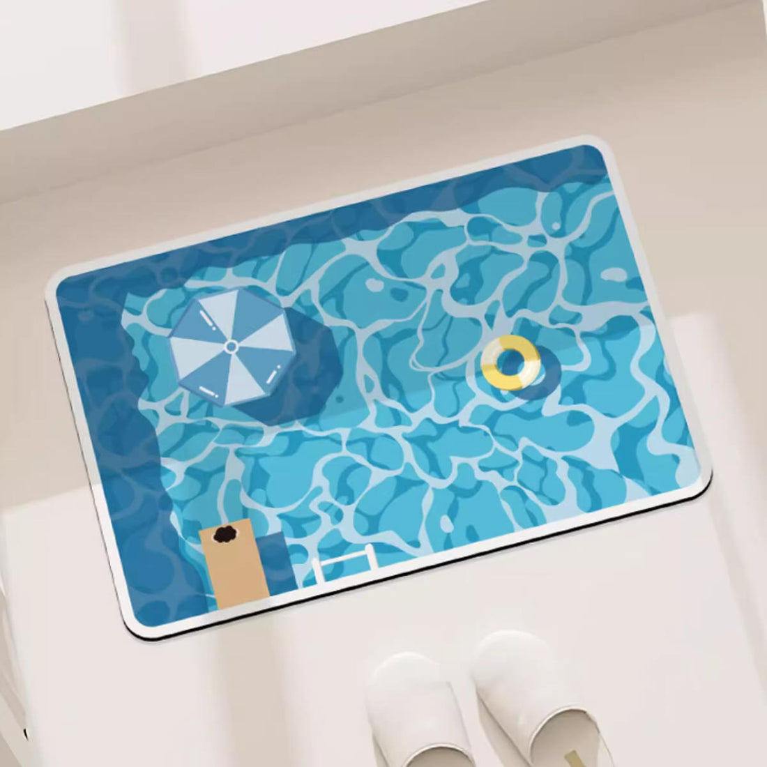 Rectangular bath mat with blue swimming pool print, water ripple design, and non-slip rubber backing.