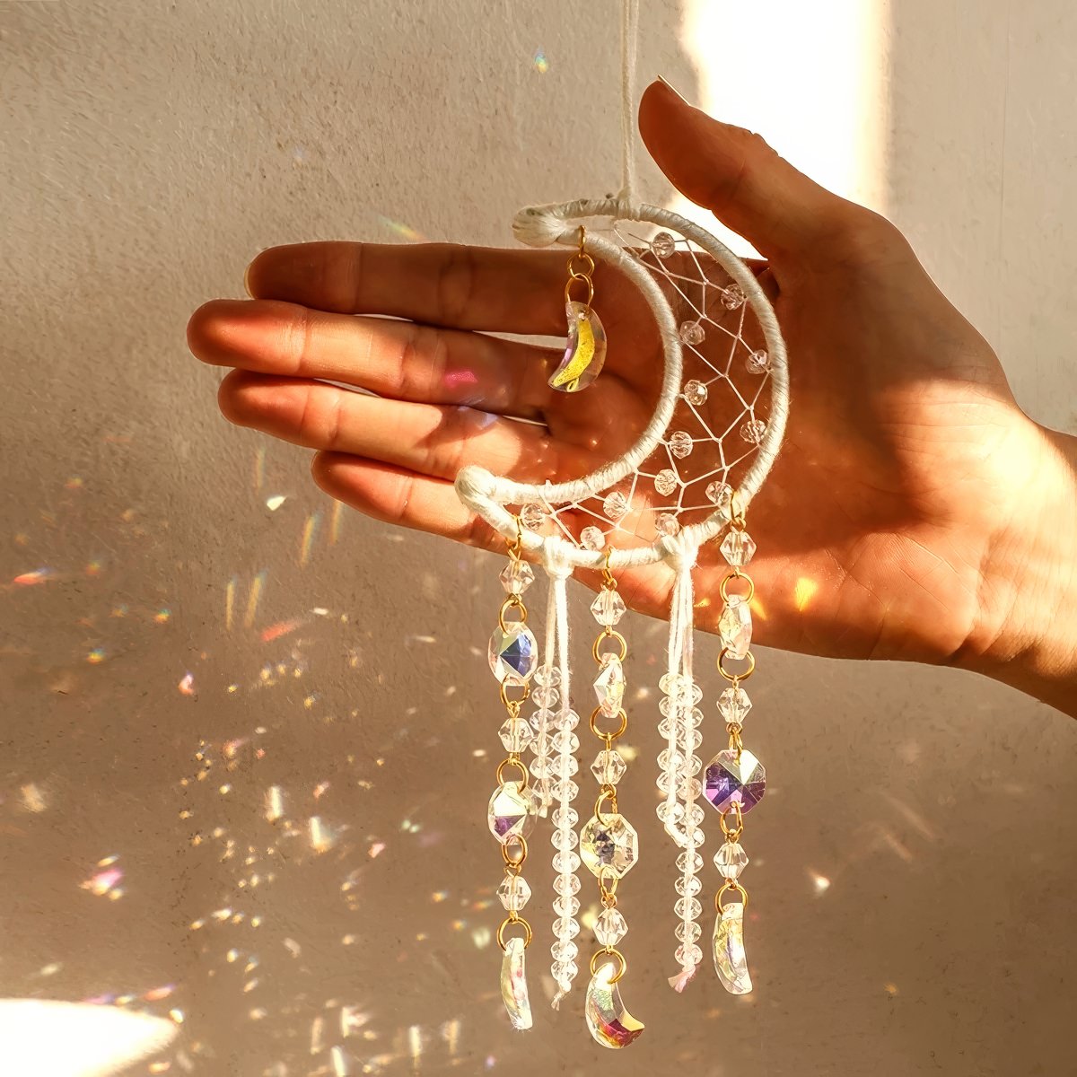Cream ivory crescent moon dream catcher suncatcher with woven macrame web, cascading iridescent crystal bead strands and AB moon charms