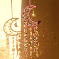 Cream ivory crescent moon dream catcher suncatcher with woven macrame web, cascading iridescent crystal bead strands and AB moon charms
