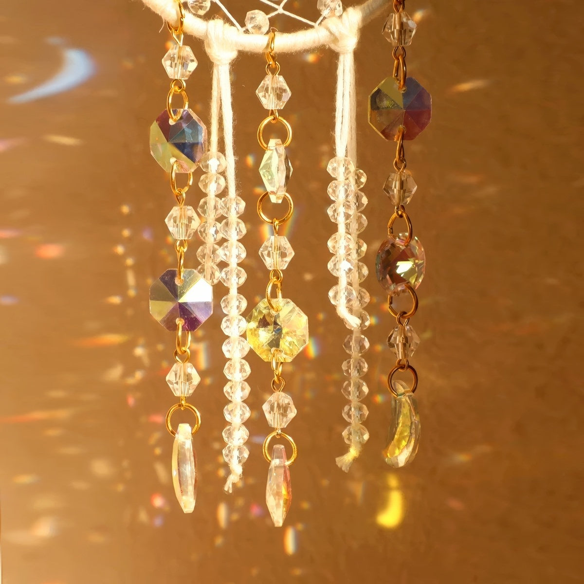 Cream ivory crescent moon dream catcher suncatcher with woven macrame web, cascading iridescent crystal bead strands and AB moon charms