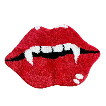 aesthetic accent tufted rug in the shape of red lips with an open mouth, featuring white vampire fangs and black shading inside the mouth