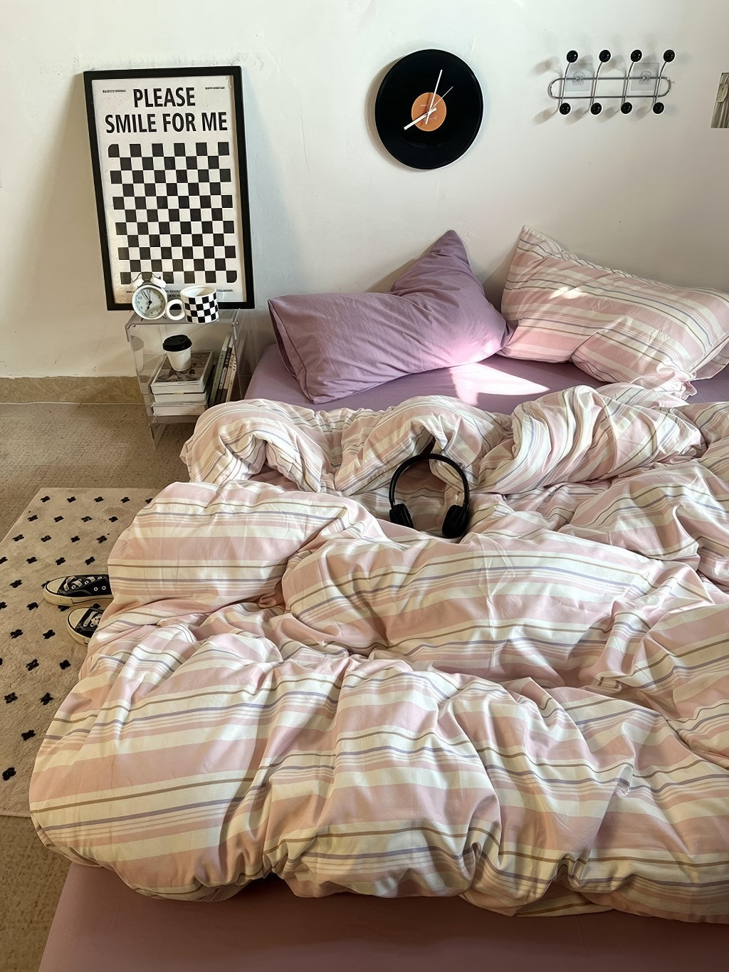 pastel pink striped bedding duvet cover set with matching pastel purple pillow case and fitted sheet