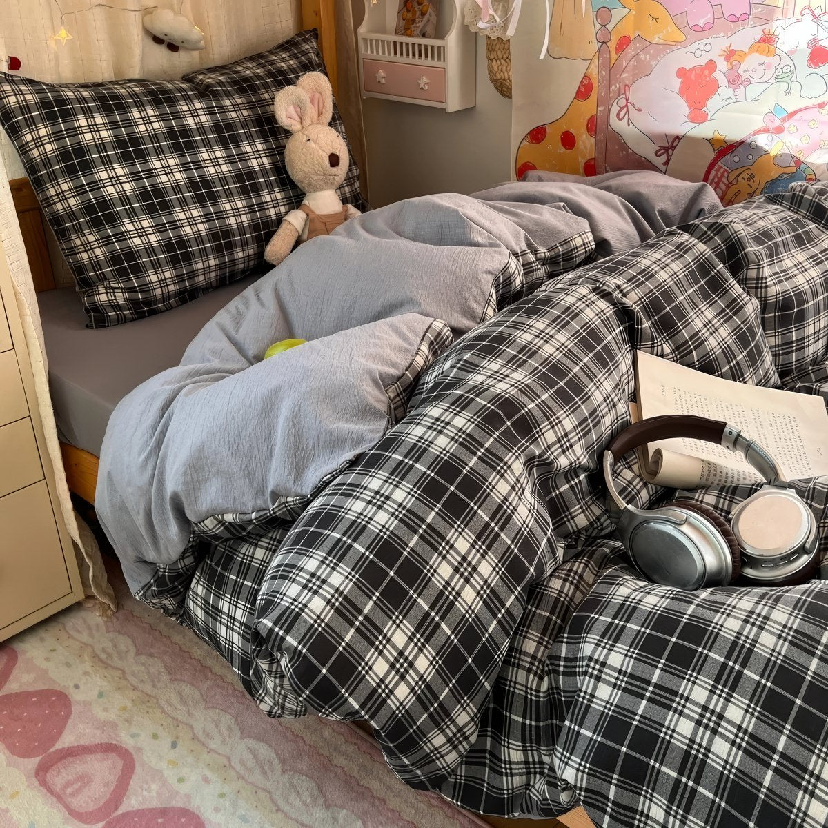 Black and brown plaid bubble crinkle bedding set with matching pillows on a cozy bedroom bed
