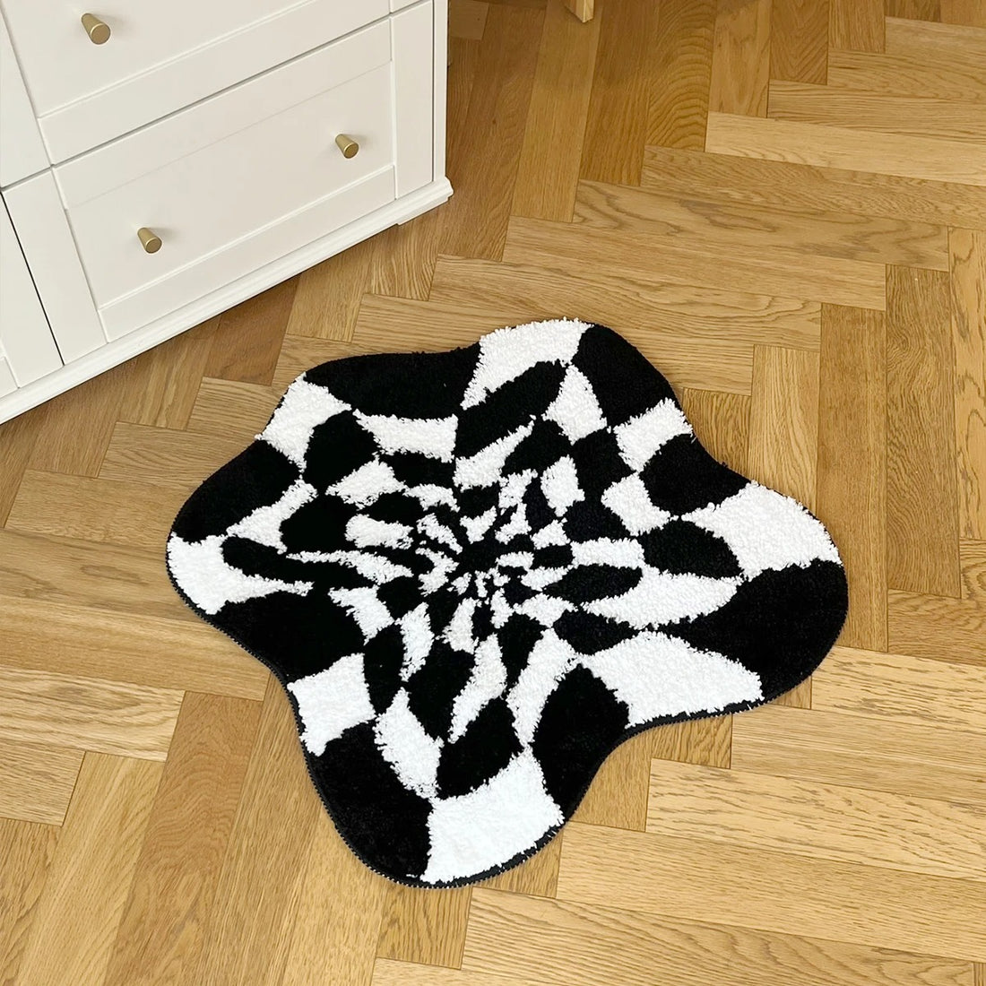 Black and white wavy checkered tufted rug with optical illusion pattern