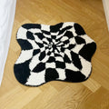 Black and white wavy checkered tufted rug with optical illusion pattern