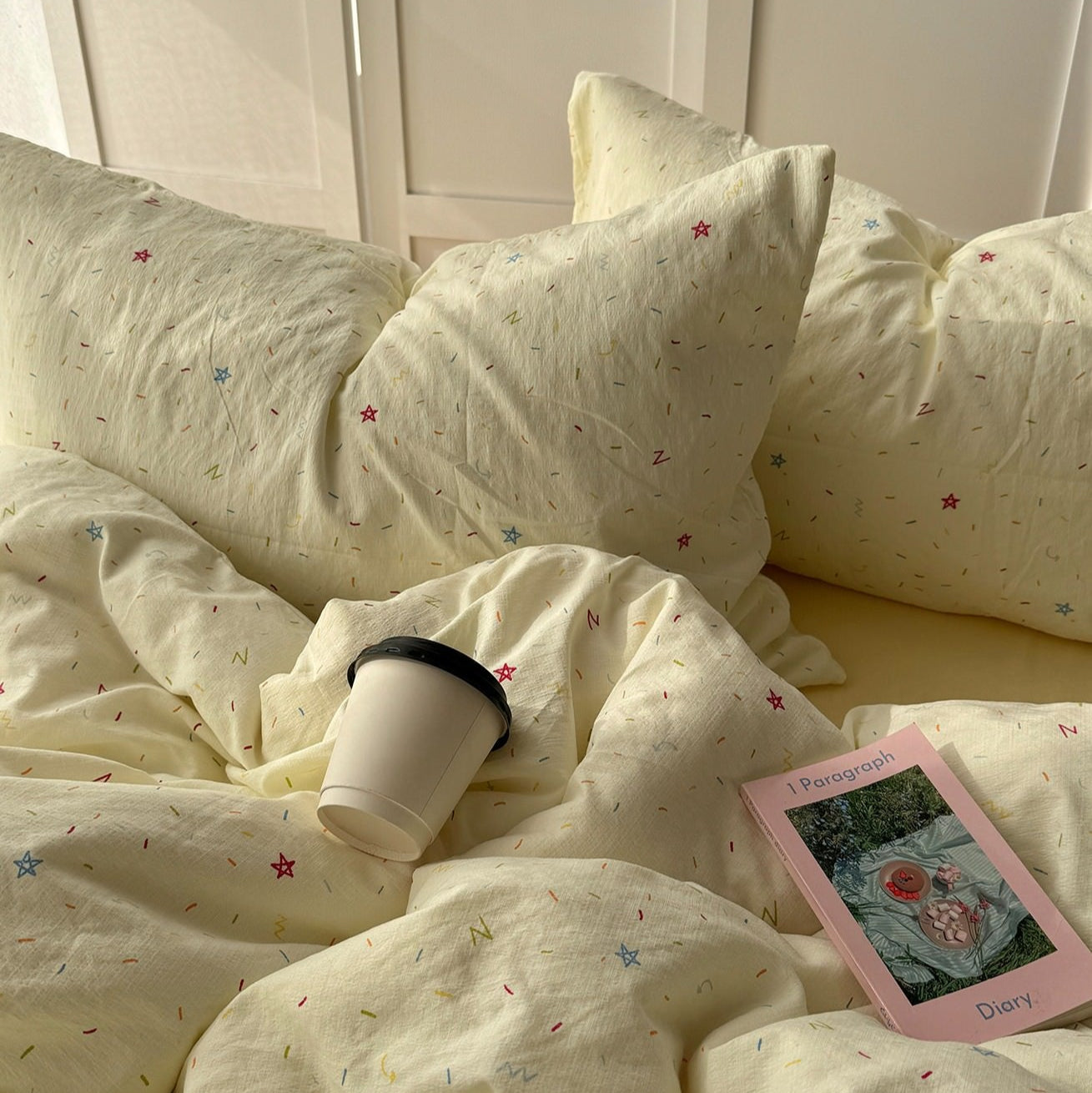 yellow creamy pastel bedding set with colorful sprinkles print pattern 