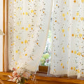 Sheer curtain with yellow floral pattern 