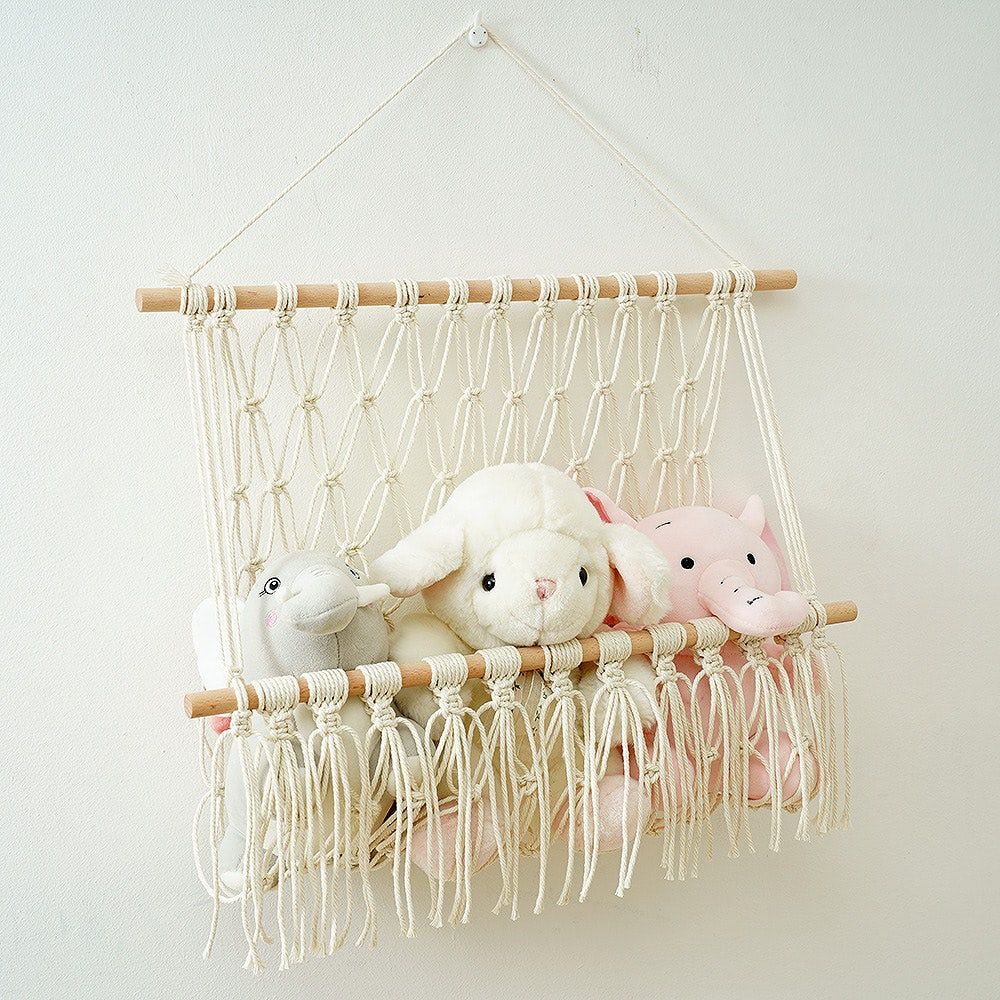 macrame wall hanging storage pocket for books and toys roomtery