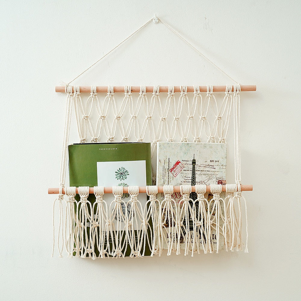 macrame wall hanging storage pocket for books and toys roomtery