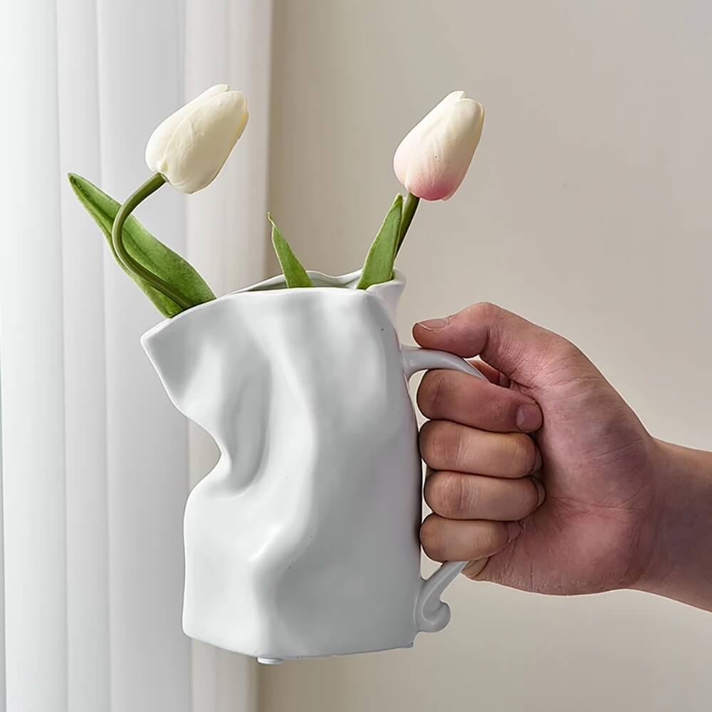 https://roomtery.com/cdn/shop/products/minimalit-aesthetic-crumple-tyle-mug-shaped-ceramic-vase-roomtery6.jpg?v=1679655961&width=1946