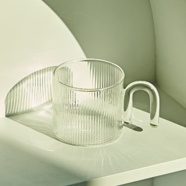 https://roomtery.com/cdn/shop/products/retro-striped-ripple-glass-vintage-mug-with-arch-handle-room-decor-roomtery7.jpg?v=1660317801&width=1946